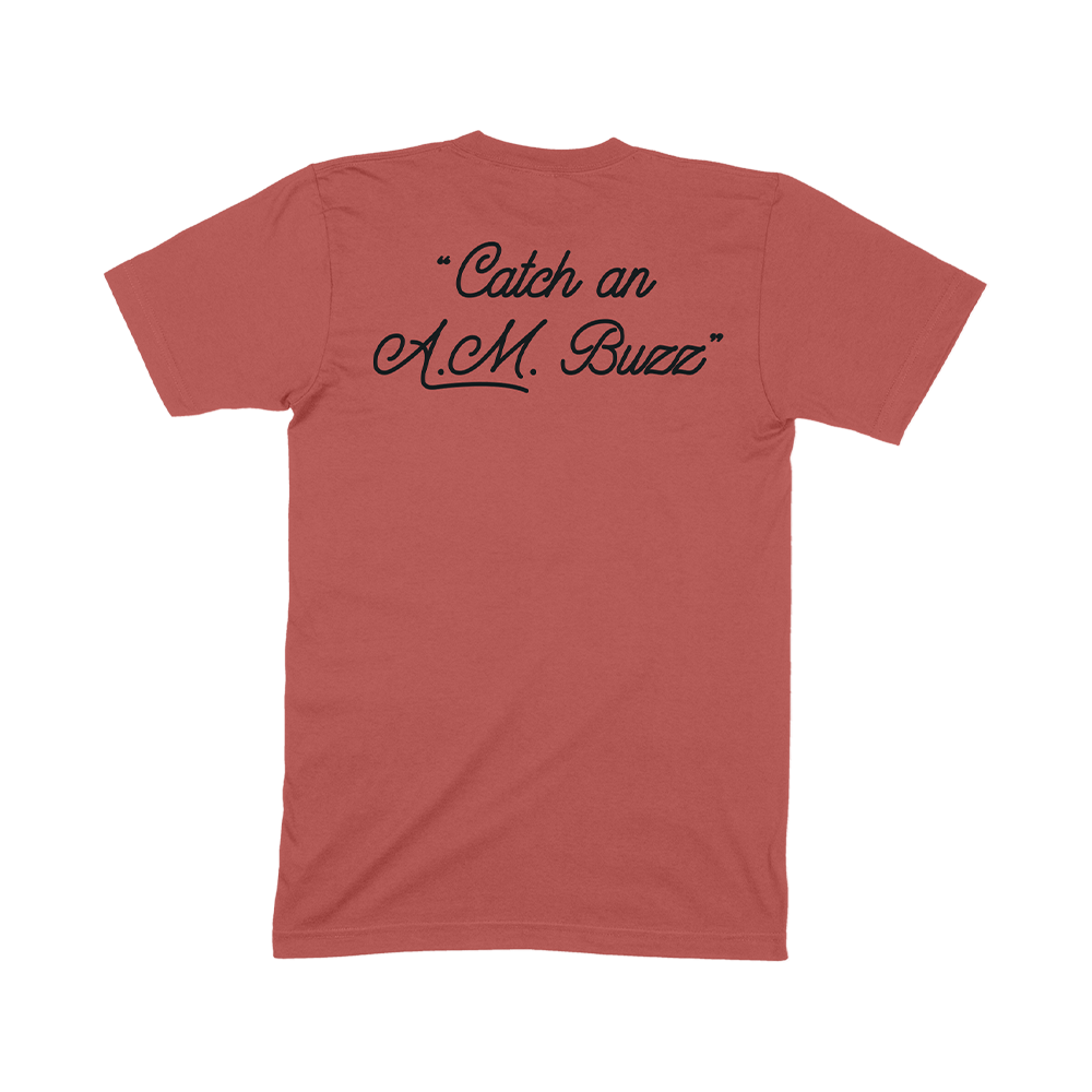 Red t-shirt with black text reading ’Catch an A.M. Buzz’ on the back.