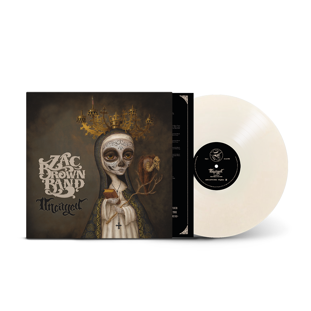 Vinyl record album of Zac Brown Band’s ’Uncaged’ with striking Day of the Dead-inspired cover art.