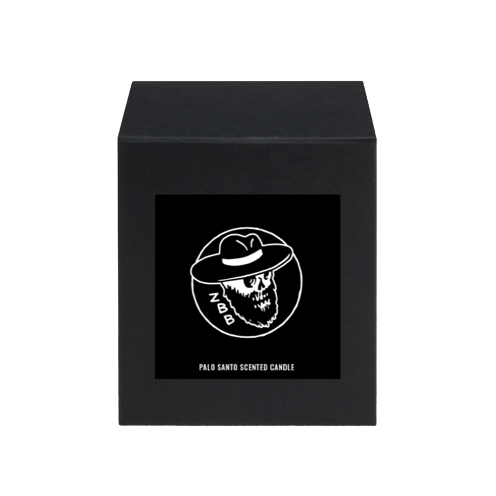 Black box with a skull logo and ’Palo Santo Scented Candle’ text on the front.