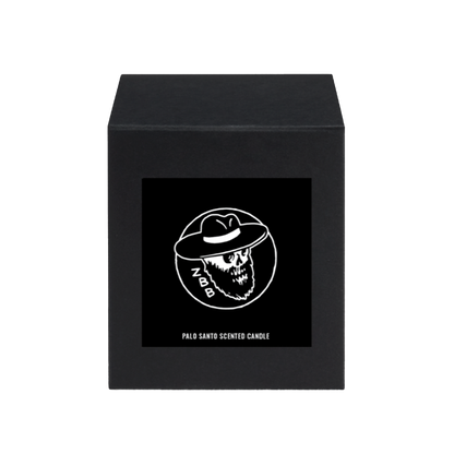Black box with a skull logo and ’Palo Santo Scented Candle’ text on the front.