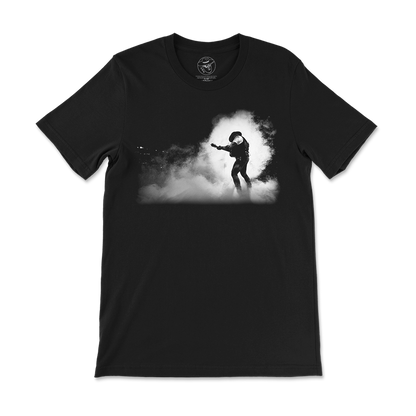 Black t-shirt with a silhouette design of a guitarist performing in smoke or fog.