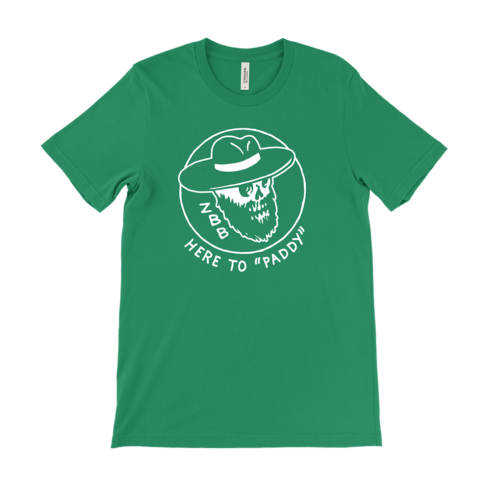 Green t-shirt with a white graphic design featuring a bearded face in a hat and the text ’HERE TO ’PADDY’’.