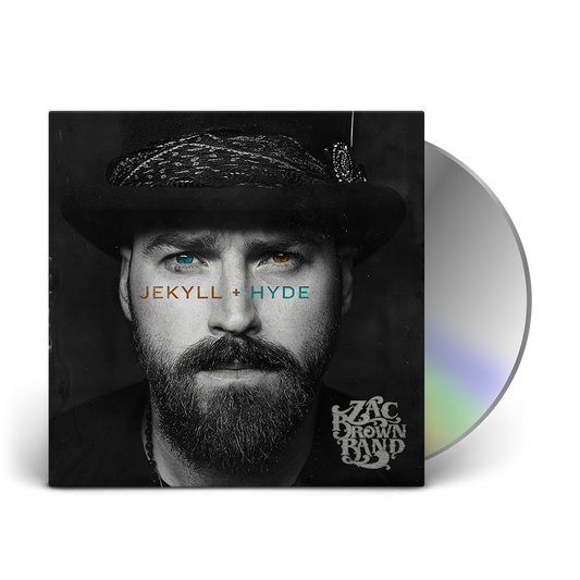Album cover for ’Jekyll + Hyde’ by Zac Brown Band featuring a close-up portrait of a bearded man in a hat with heterochromatic eyes.