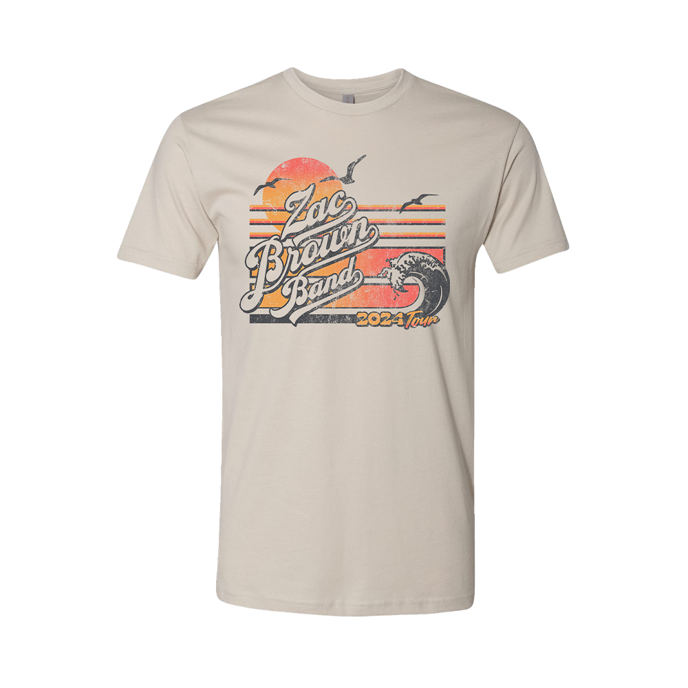 Beige t-shirt featuring a retro-style ’Zac Brown Band 2024 Tour’ graphic design with a sunset and wave motif.