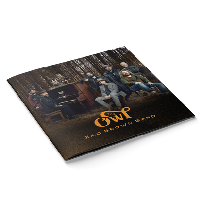 Album cover for ’The Owl’ by Zac Brown Band featuring the band members in a forest setting.