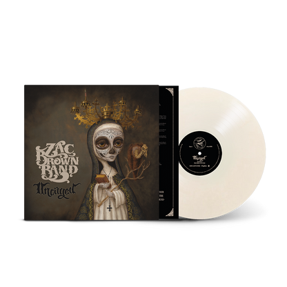 Vinyl record album of Zac Brown Band’s ’Uncaged’ with striking Day of the Dead-inspired cover art.