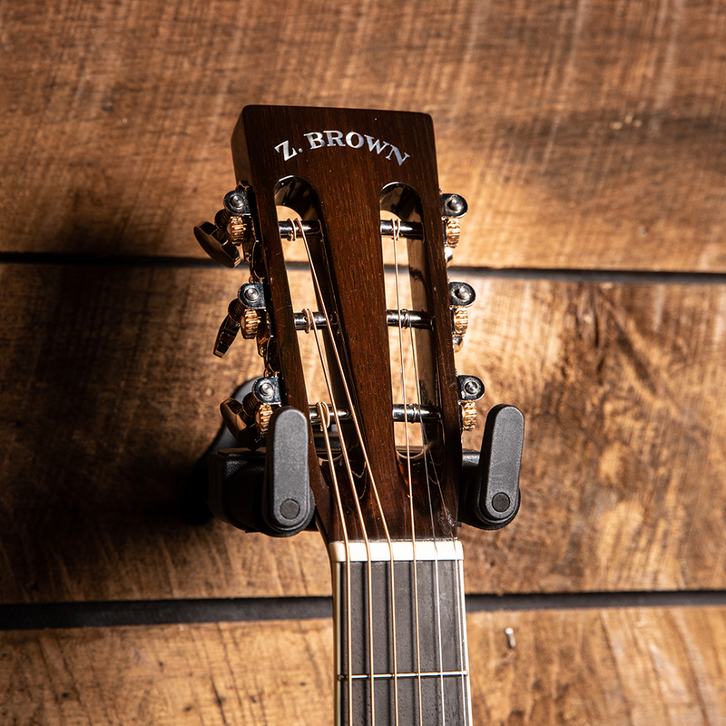 Headstock of a Z. Brown acoustic guitar with metal tuning pegs.